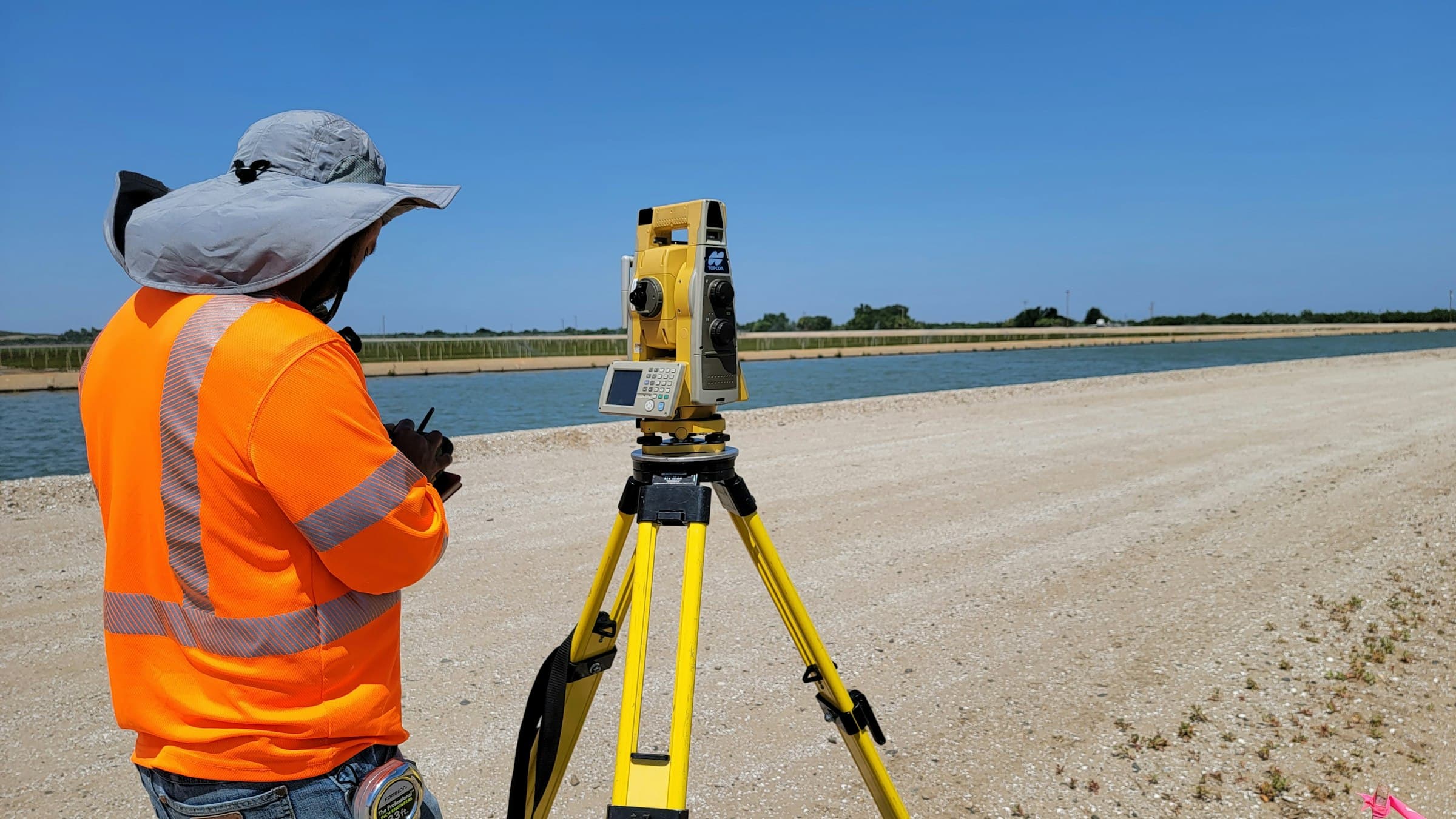 Surveyor working with a total station on a levelled site