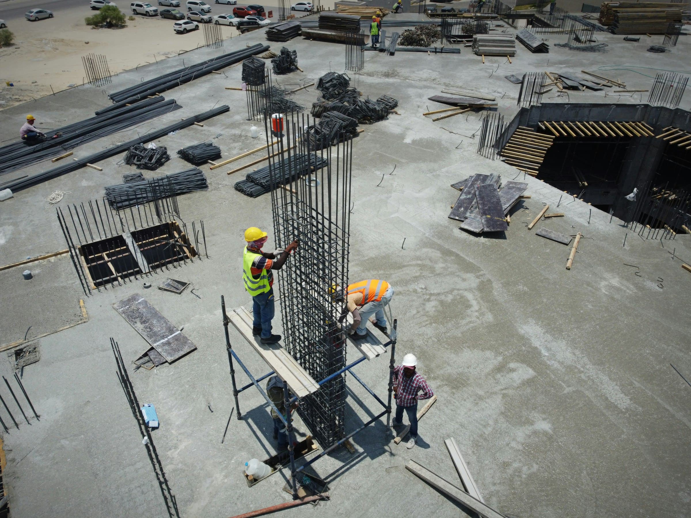 Aerial view of a crew fixing rebar on a concrete deck